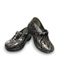Dansko XP 2.0 patent clog showing the black slip-resistant rubber outsole and glitter wave pattern. Photo of front view.