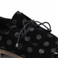 DJANGO & JULIET KOTTY black leather loafers with polka dot pattern and patent leather toe cap. Photo of middle view.