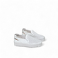 Django & Juliette white leather slip-on sneakers with perforated upper and thick cleated sole. Photo of side views.