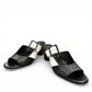 Django & Juliette Conrade black and cream leather heeled sandals with a buckle detail. Photo of front side view.