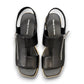 Django & Juliette Kemma black leather platform slides with a silver zip detail and notched sole. Photo of upper view.