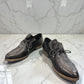 Django & Juliette Kotty black leather loafer with a low heel and decorative lace detail. Photo of front side view.
