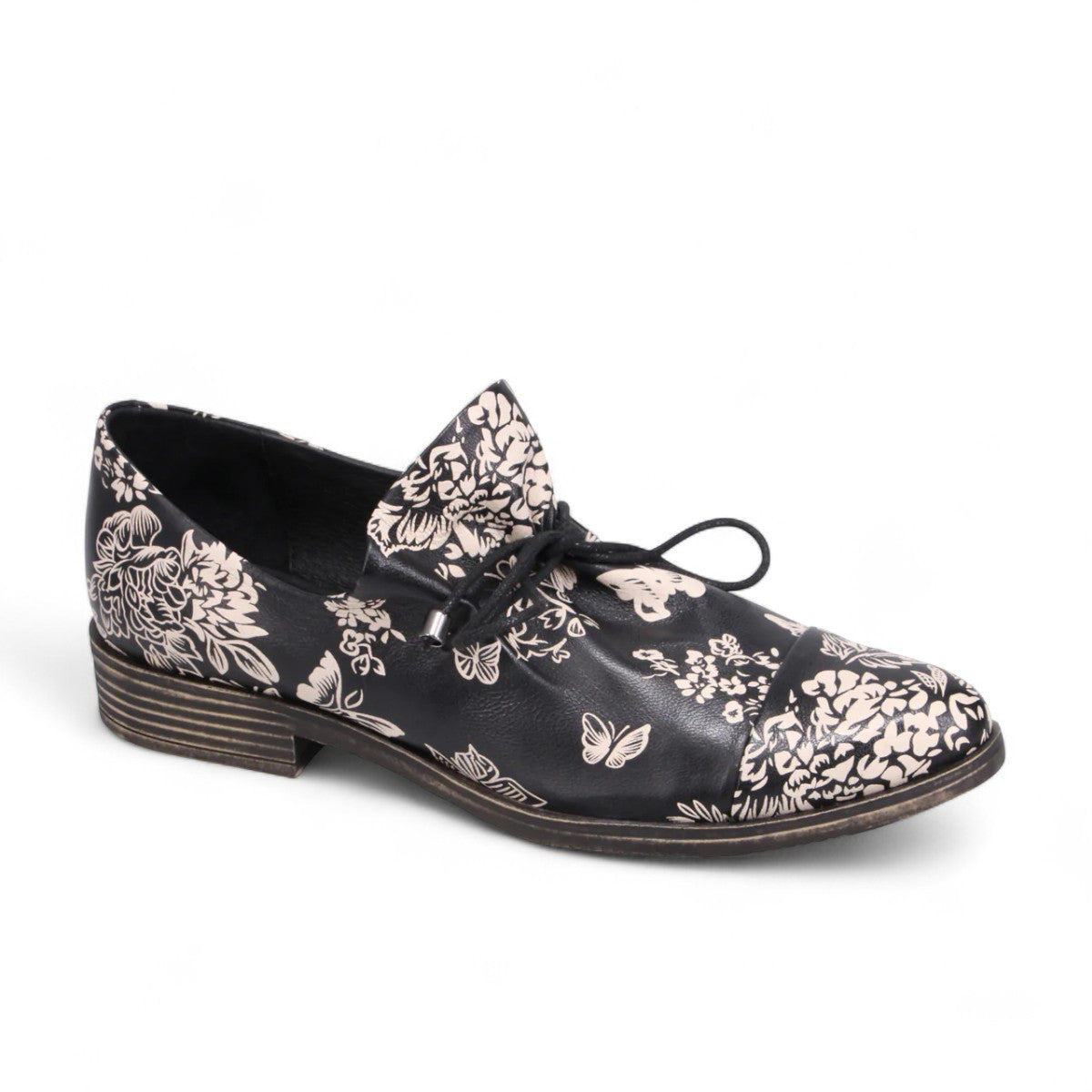 DJANGO & JULIETTE Kotty black and milk floral leather loafer with lace-up detail and rubber outsole. Photo of front side view.