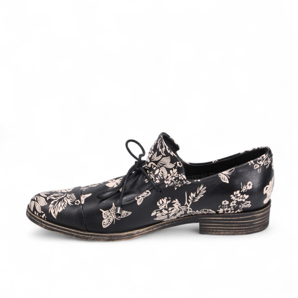 DJANGO & JULIETTE Kotty black and milk floral leather loafer with lace-up detail and rubber outsole. Photo of left side view.