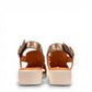 DJANGO & JULITTE Madis tan and champagne two-tone leather wedge sandals with a platform sole. Photo of back view.