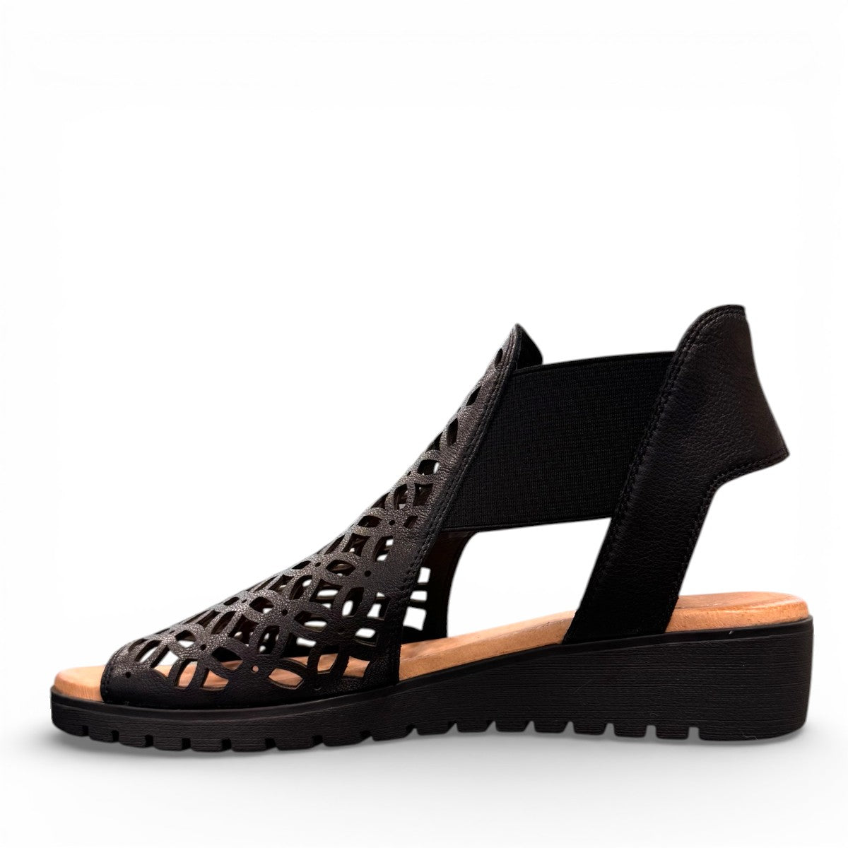 Django & Juliette Montaen black leather platform wedge sandals with laser-cut detailing and ankle strap. Photo of left side view.
