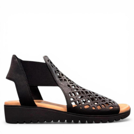 Django & Juliette Montaen black leather platform wedge sandals with laser-cut detailing and ankle strap. Photo of right side view.