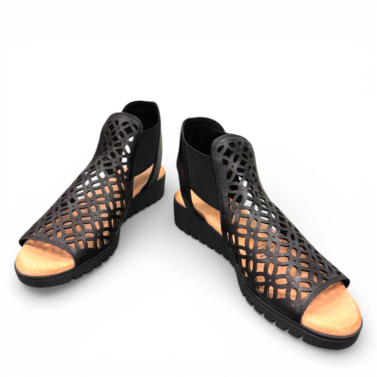 Django & Juliette Montaen black leather platform wedge sandals with laser-cut detailing and ankle strap. Photo of front side view 2.
