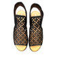 Django & Juliette Montaen black leather platform wedge sandals with laser-cut detailing and ankle strap. Photo of upper view.