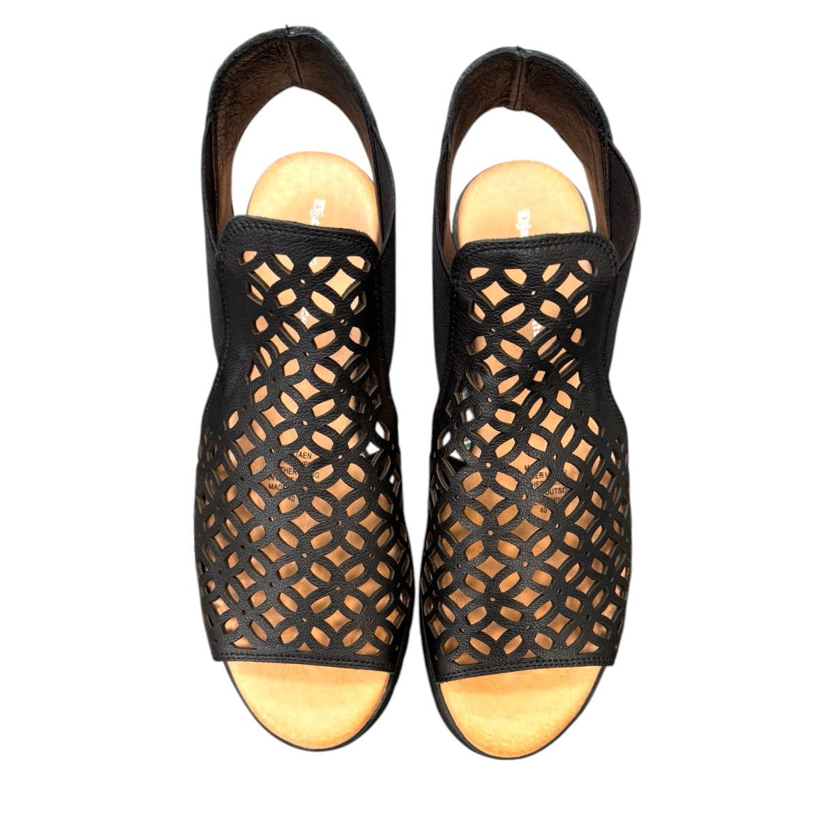 Django & Juliette Montaen black leather platform wedge sandals with laser-cut detailing and ankle strap. Photo of upper view.