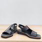 Django & Juliette Kemma navy leather platform slides with a square toe and silver zip detail. Photo of front side view 2.