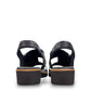 Django & Juliette Kemma navy leather platform slides with a square toe and silver zip detail. Photo of back view.