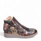 DJANGO & JULIET OHMY ankle boot in blue floral leather with an asymmetrical front zipper and wedge heel. Photo of right side view.