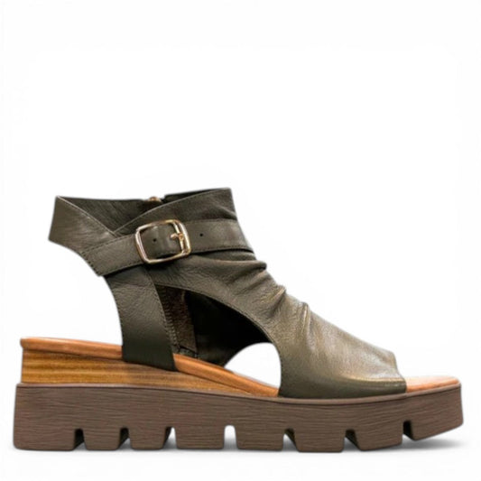 Django & Juliette Rufuss olive green leather wedge sandals with cut-out design and buckle strap. Photo of right side view.