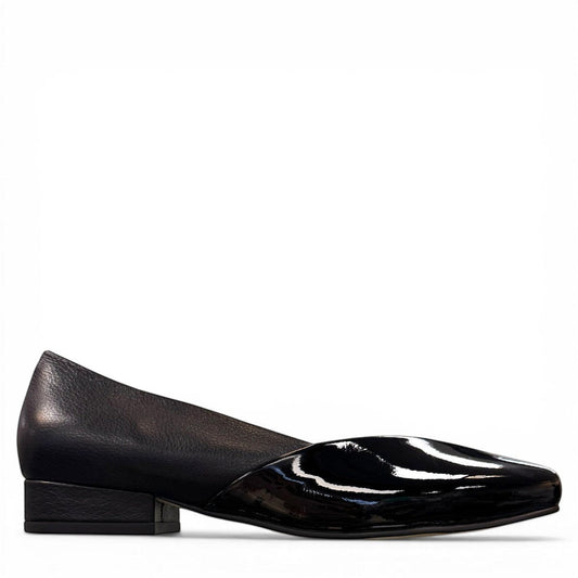 DJANGO & JULIETTE Bavari black leather slip-on heel with a glossy patent toe and low block heel. right view.