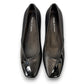 DJANGO & JULIETTE Bavari black leather slip-on heel with a glossy patent toe and low block heel. top view.