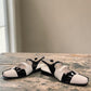 DJANGO & JULIETTE Brynins black and white patent leather slingback Mary Jane flat with block heel. front view.