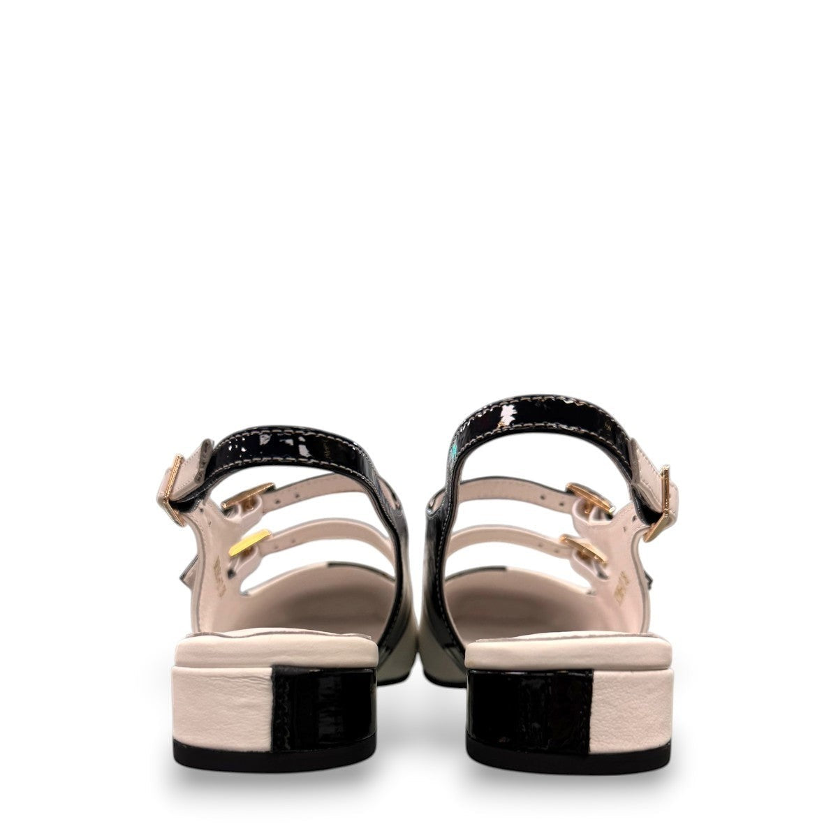 DJANGO & JULIETTE Brynins black and white patent leather slingback Mary Jane flat with block heel. back view.