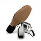 DJANGO & JULIETTE Brynns black and white patent leather slingback Mary Jane flat with buckled straps.
bottom view.