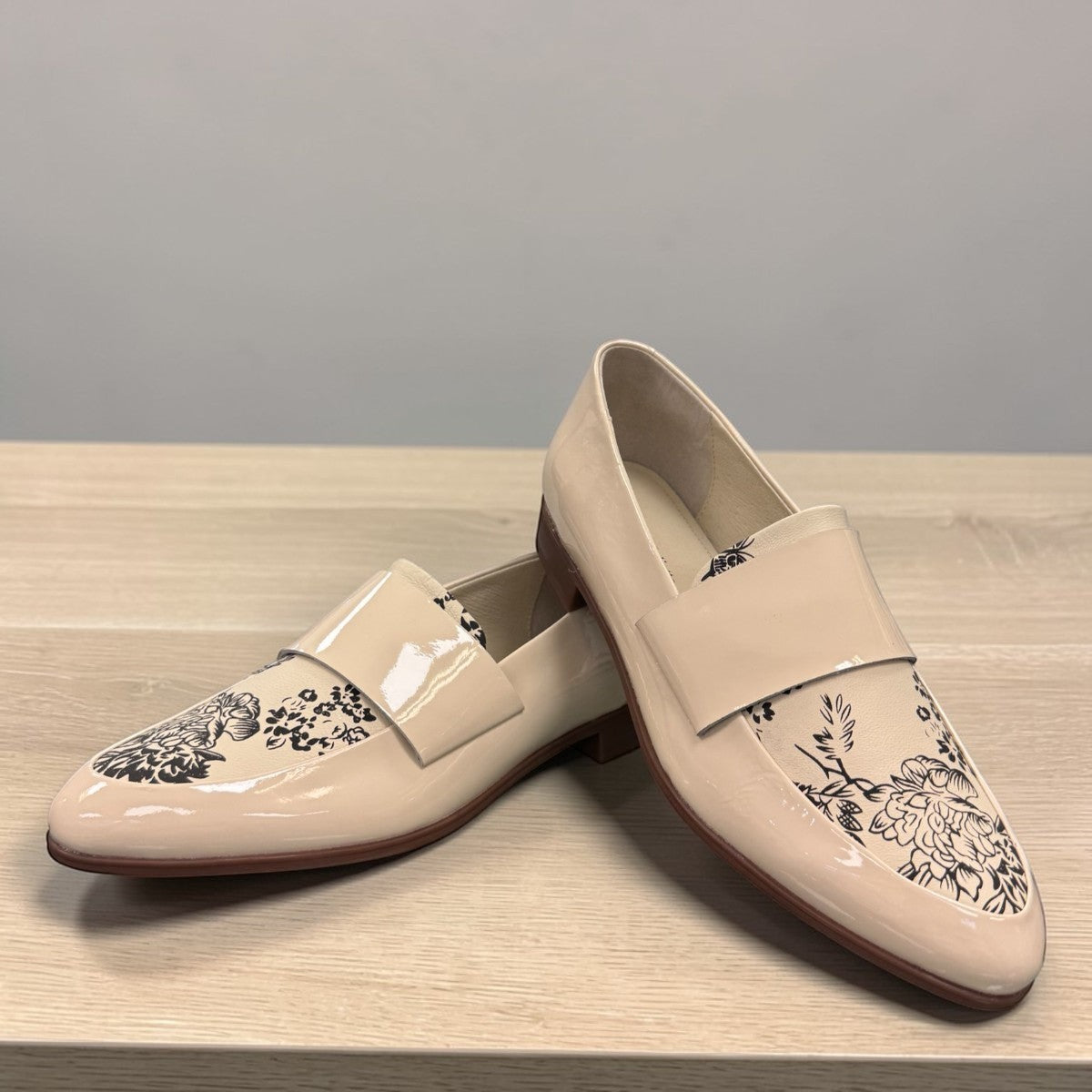 Django & Juliette Gabrian patent leather loafers in milk and black floral print with a low rubber heel. front view.