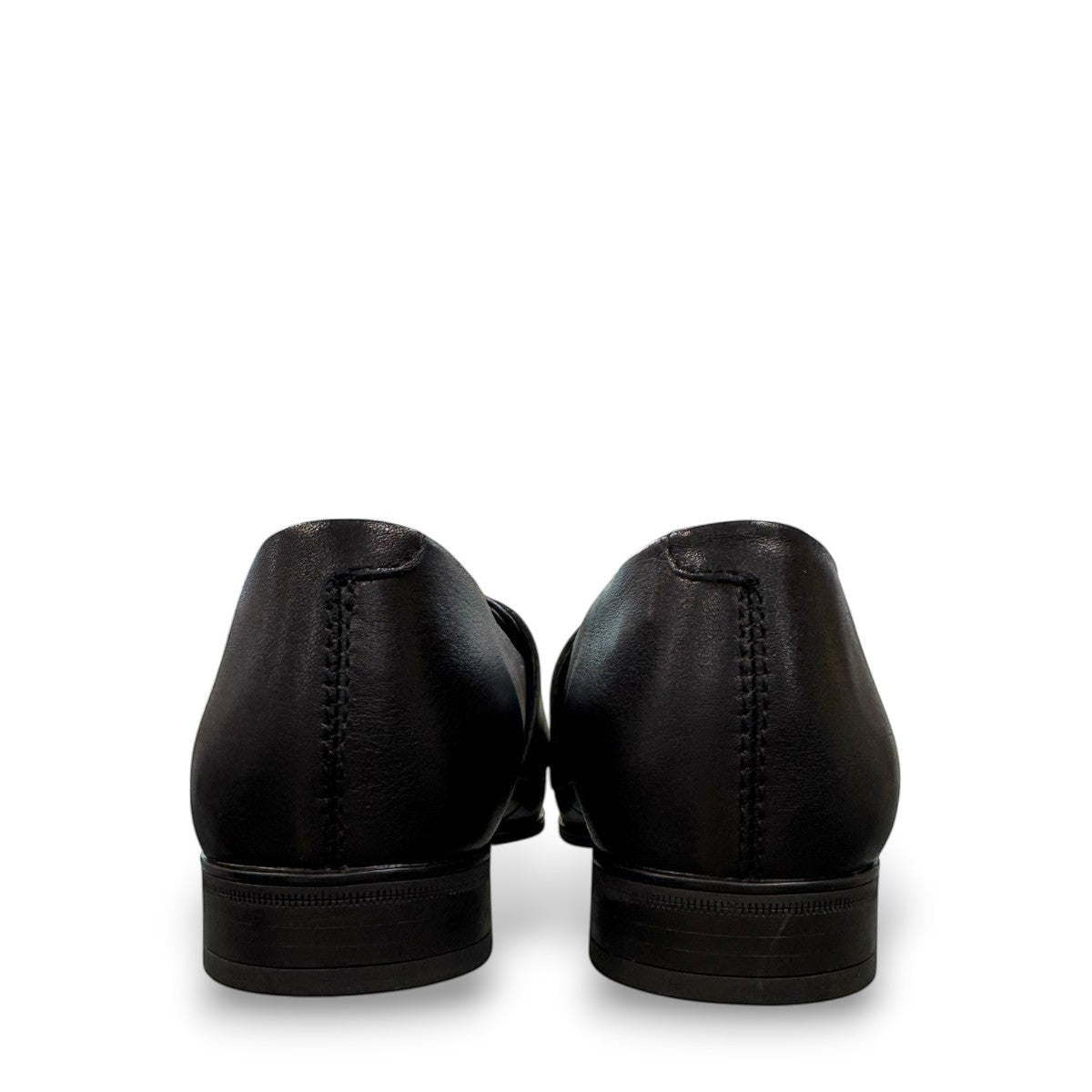 Django & Juliette Gabrian black leather loafers with a low block heel and slip-on design. back view.