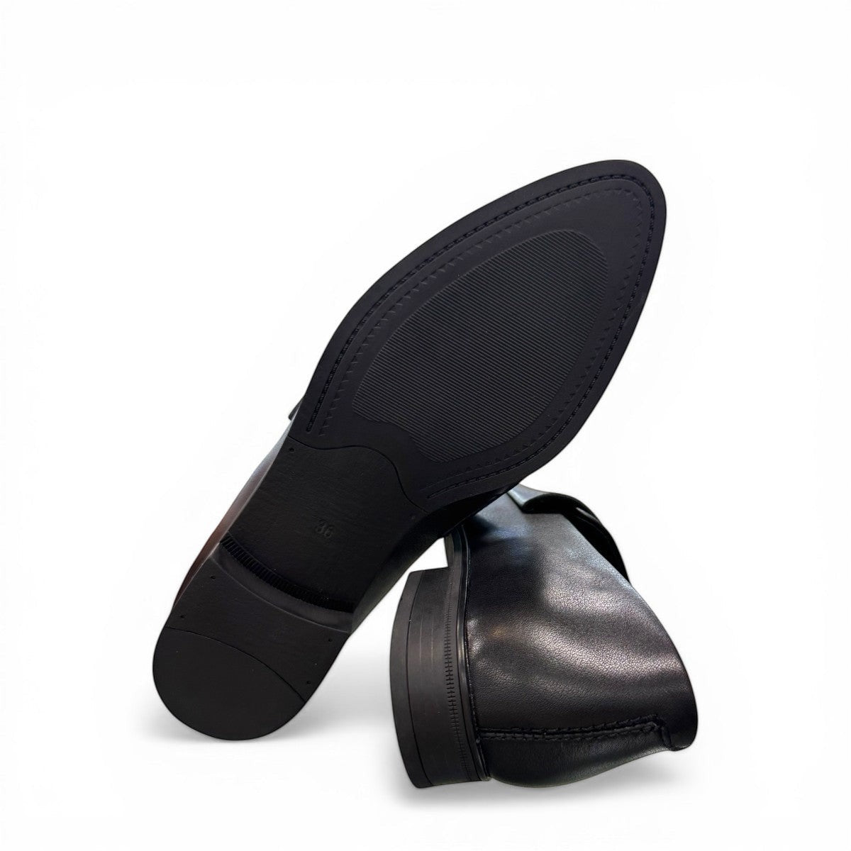 Django & Juliette Gabrian black leather loafers with a low block heel and slip-on design. bottom view.