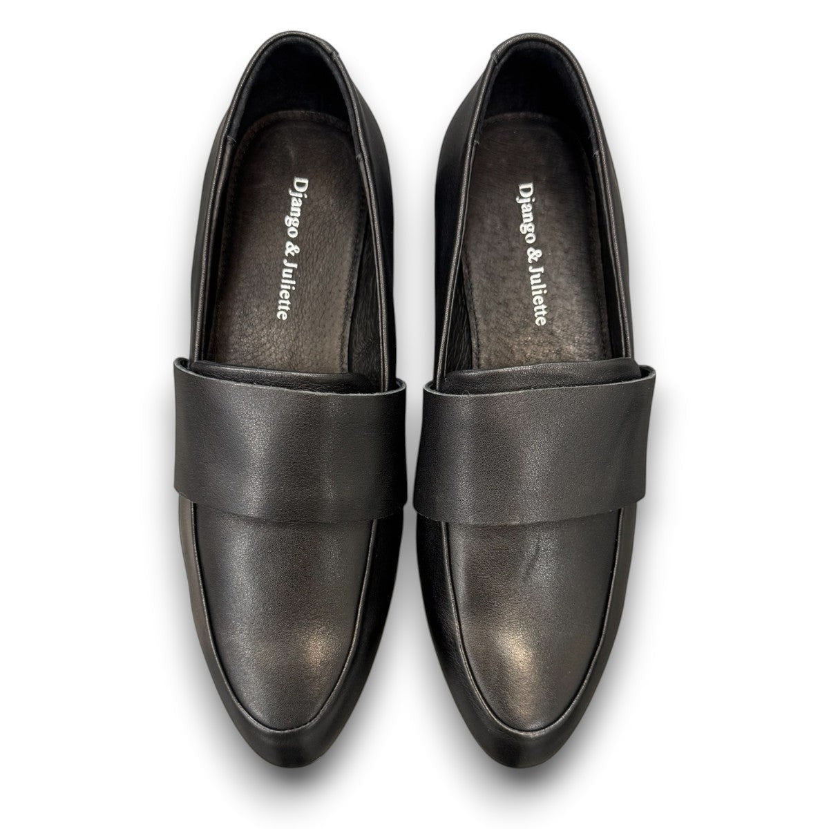 Django & Juliette Gabrian black leather loafers with a low block heel and slip-on design. top view.