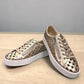 Django & Juliette Leithah metallic platino leather sneakers with heart cutouts and white platform sole. front view.