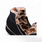 Sina Footwear Django & Juliette Opal black leather flatform wedge bootie with side zipper and fur-lined interior. Photo of the inside sole of fur.