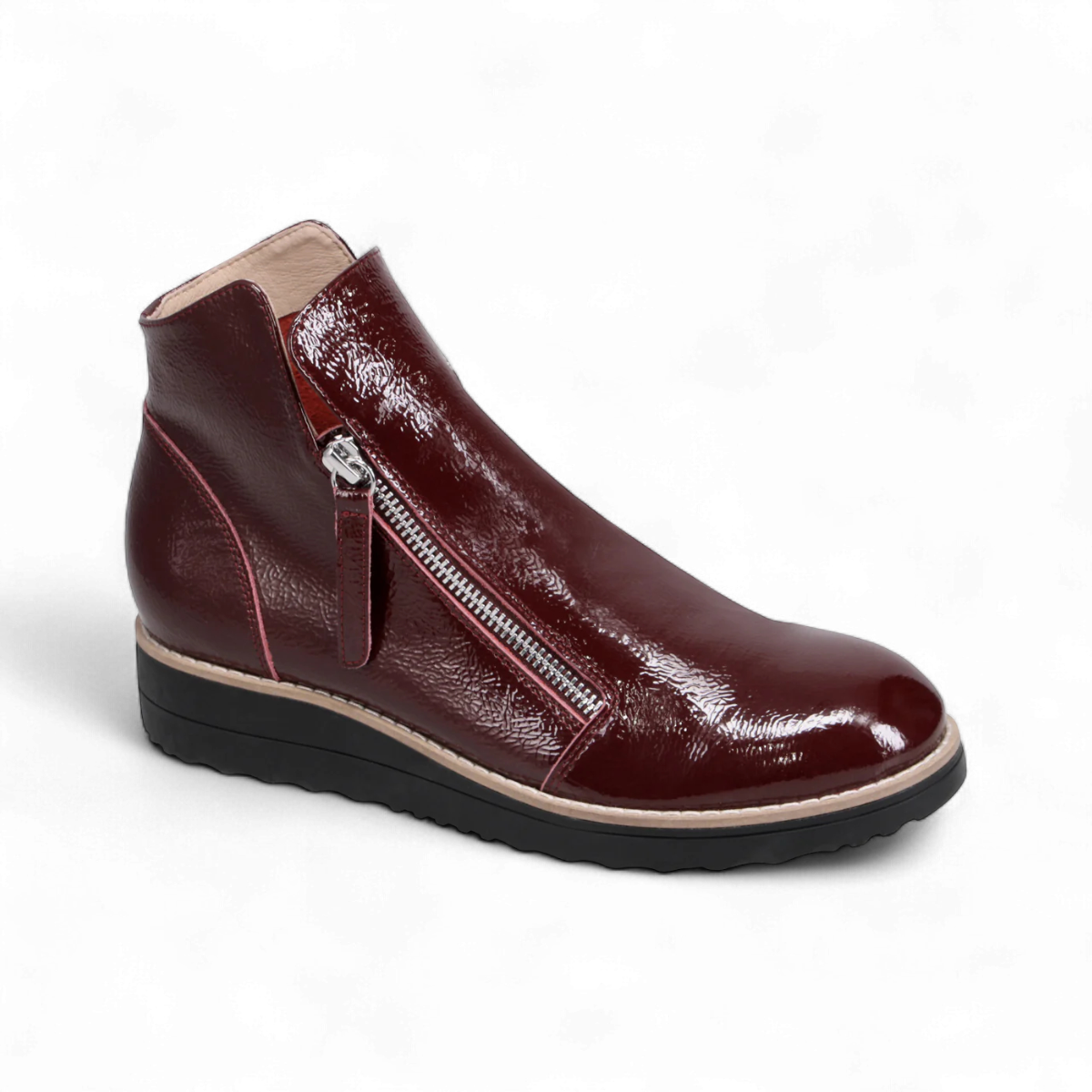 Sina Footwear DJANGO & JULIETTE wine patent leather sneaker-style ankle bootie with twin-zip and black rubber sole. Photo of front side view.