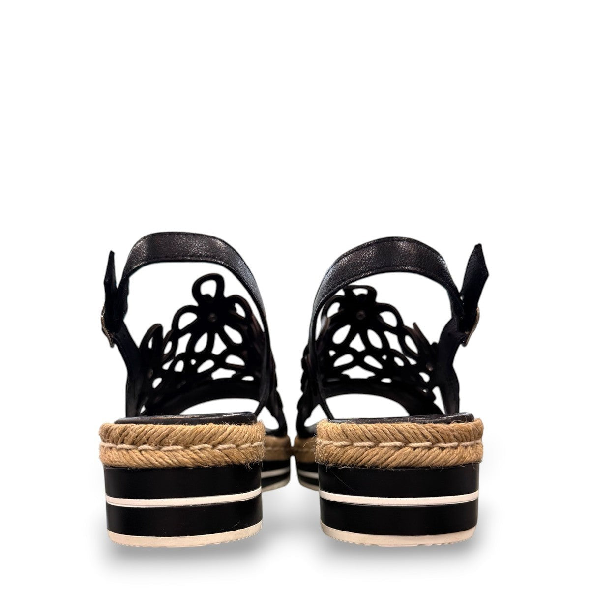DJANGO & JULIETTE black leather platform sandal with floral cut-outs and woven espadrille trim. back view.