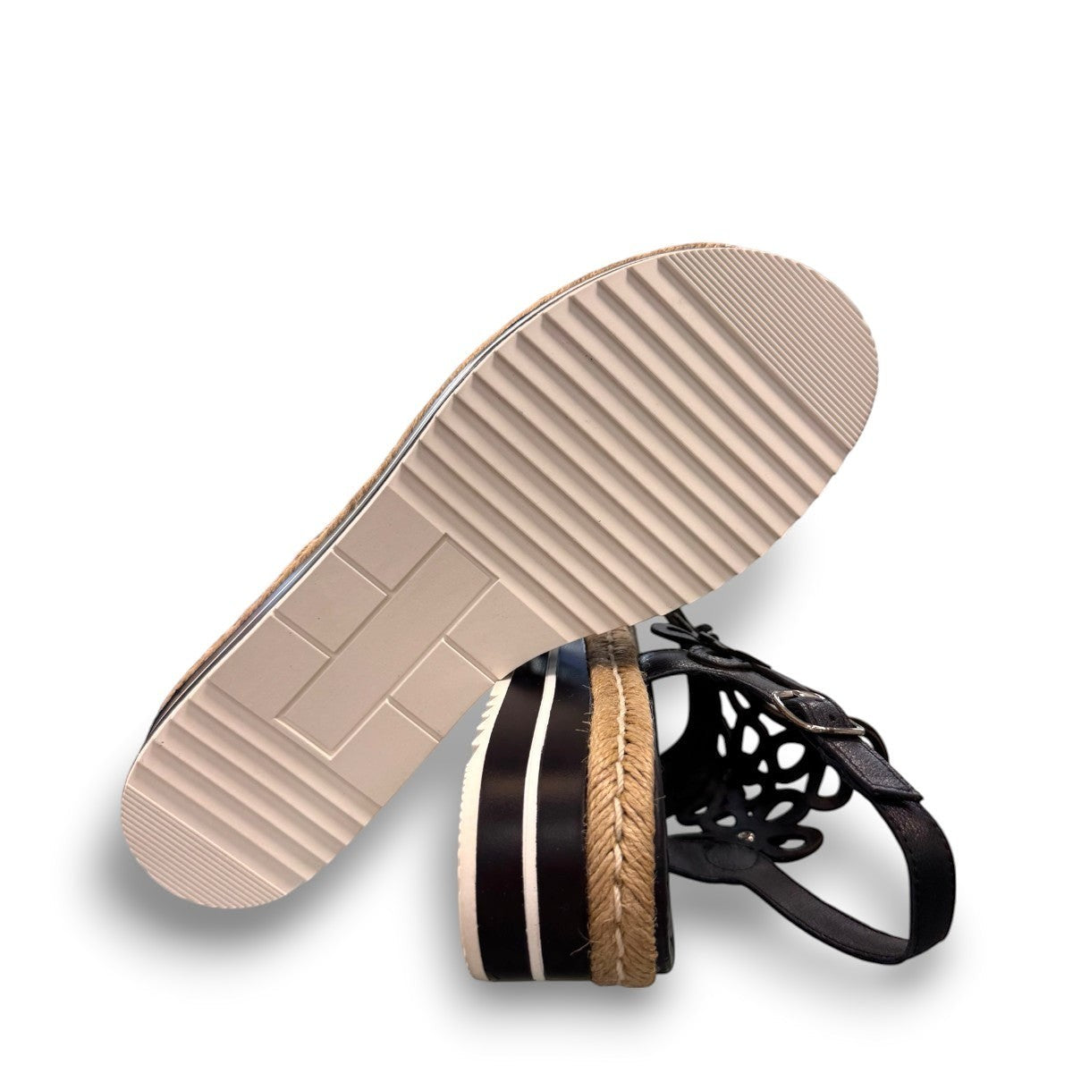 DJANGO & JULIETTE black leather platform sandal with floral cut-outs and woven espadrille trim. bottom view.