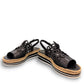 DJANGO & JULIETTE black leather platform sandal with floral cut-outs and woven espadrille trim. front view.