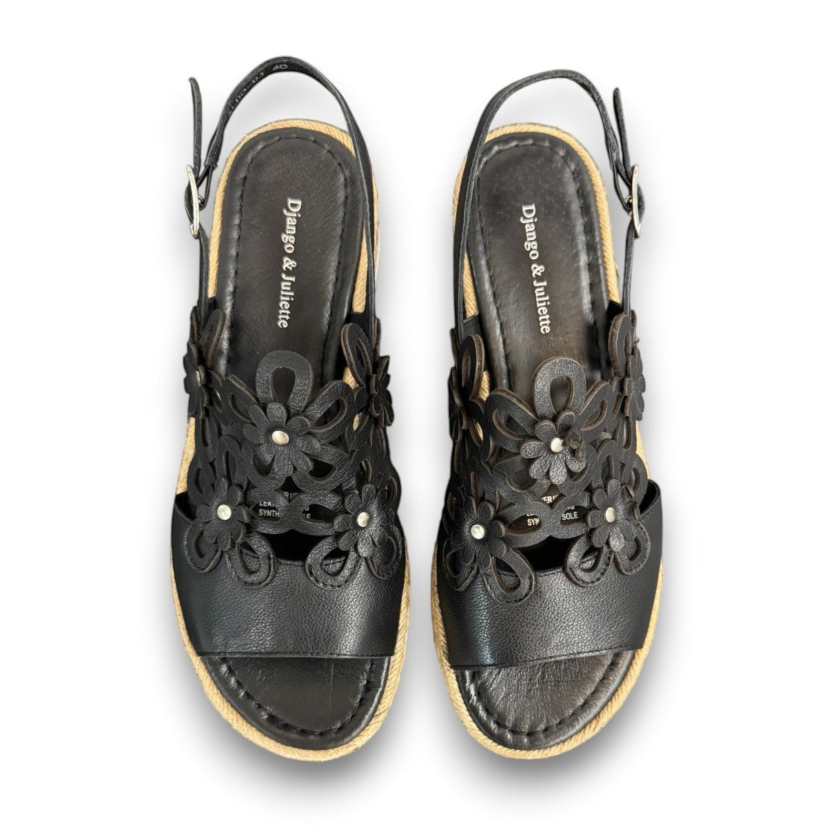 DJANGO & JULIETTE black leather platform sandal with floral cut-outs and woven espadrille trim. top view.