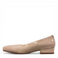 DJANGO & JULIETTE ivory leather and patent block heel pump with a rounded toe and slip-on design. left view.