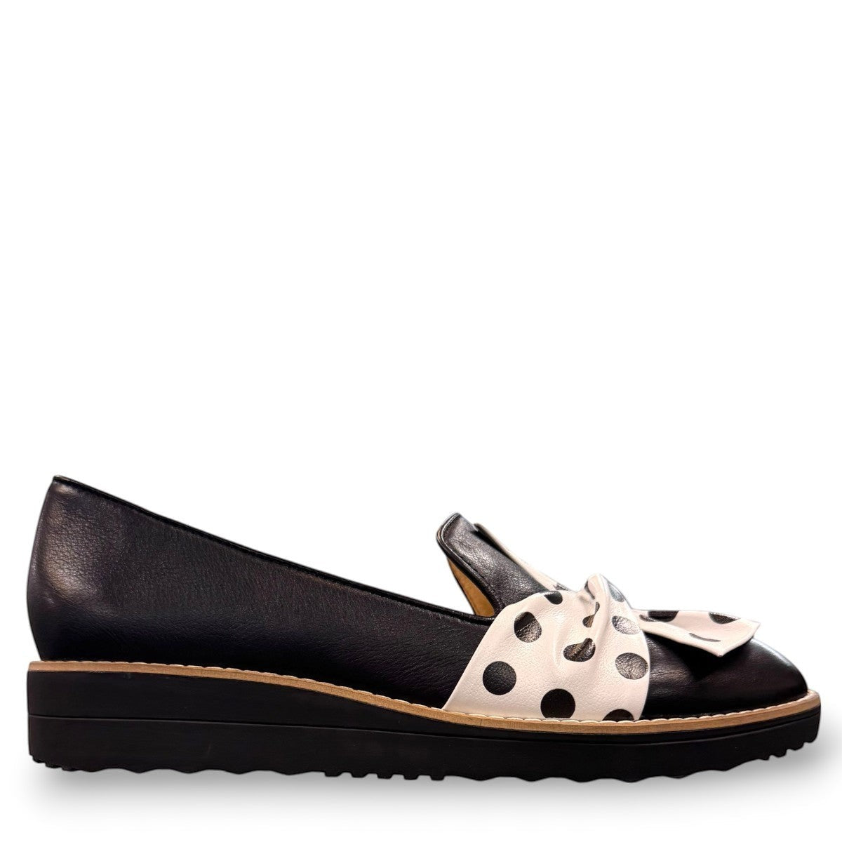DJANGO & JULIETTE black leather platform loafers with a white and black polka dot bow detail. right view.