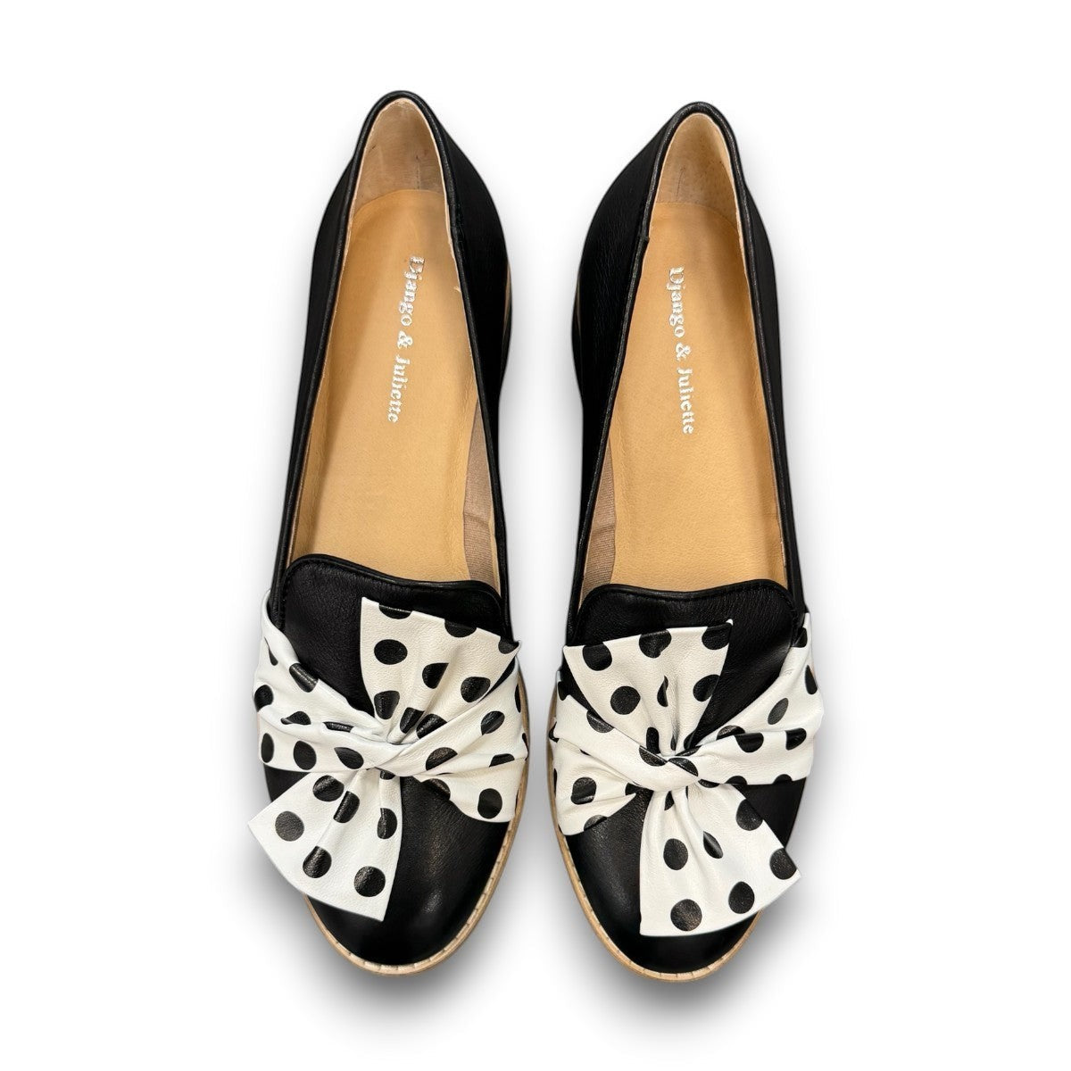 DJANGO & JULIETTE black leather platform loafers with a white and black polka dot bow detail. top view.