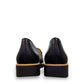 Sina Footwear DJANGO & JULIETTE black leather platform loafers viewed from the back showing the low rubber wedge heel. back view.