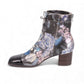 Django & Juliette Valina floral patent leather ankle boots with a square toe and block heel. left view.