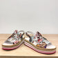 DJANGO & JULIETTE Aldo platform sandal with floral cut-outs, collage print patent leather, and espadrille. front view.