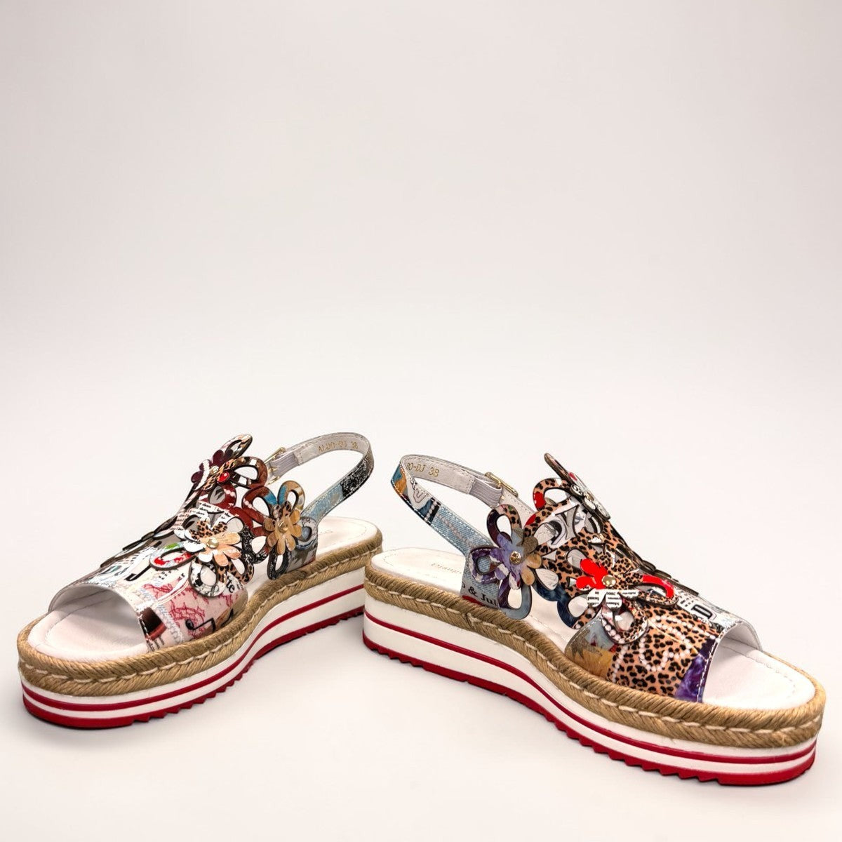 DJANGO & JULIETTE Aldo platform sandal with floral cut-outs, collage print patent leather, and espadrille. front view.