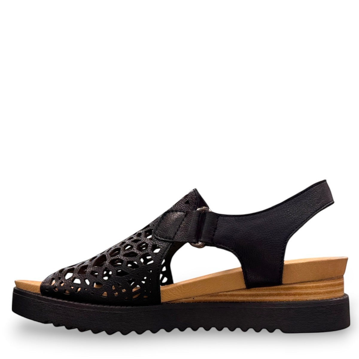 Django & Juliette black leather flatform sandals with intricate laser-cut patterns and sporty soles. left view.