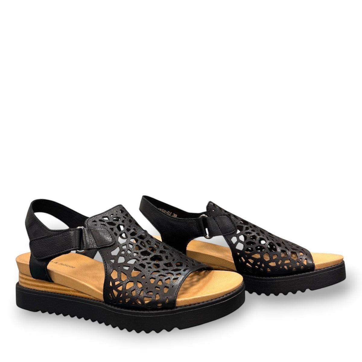 Django & Juliette black leather flatform sandals with intricate laser-cut patterns and sporty soles. right view.