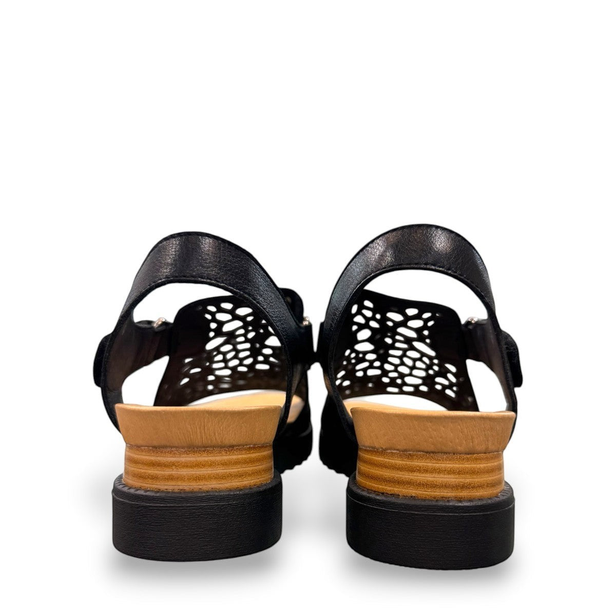Django & Juliette black leather flatform sandals with intricate laser-cut patterns and sporty soles. back view.