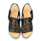 Django & Juliette black leather flatform sandals with intricate laser-cut patterns and sporty soles. top view.