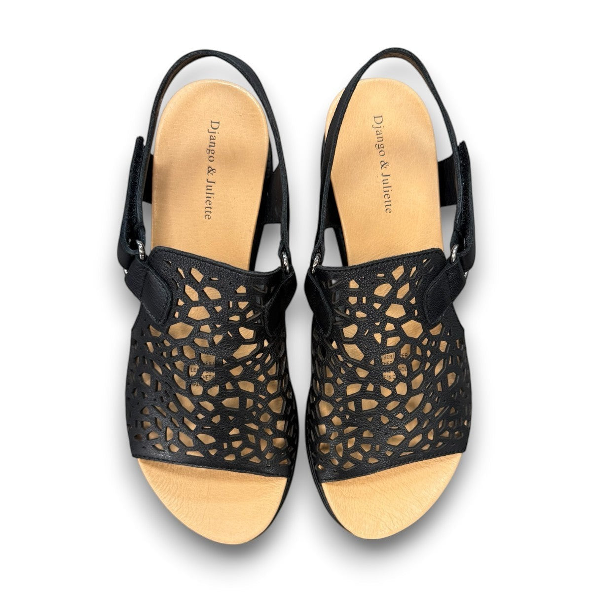 Django & Juliette black leather flatform sandals with intricate laser-cut patterns and sporty soles. top view.