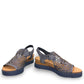 Django & Juliette blue denim leather flatform sandals with intricate laser-cut patterns and sporty sole. front view.