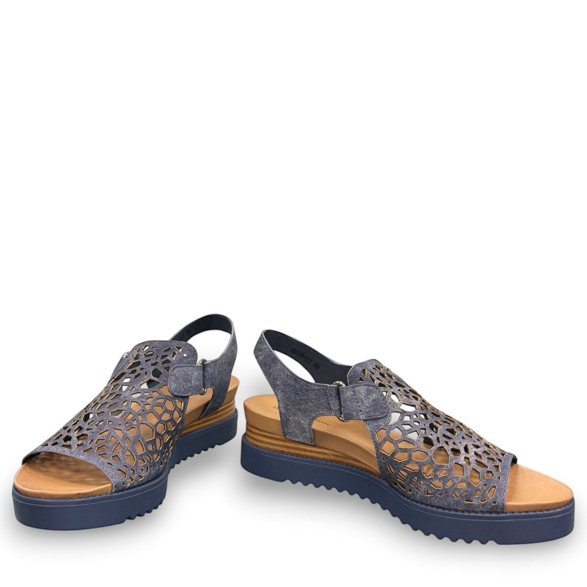 Django & Juliette blue denim leather flatform sandals with intricate laser-cut patterns and sporty sole. front view.