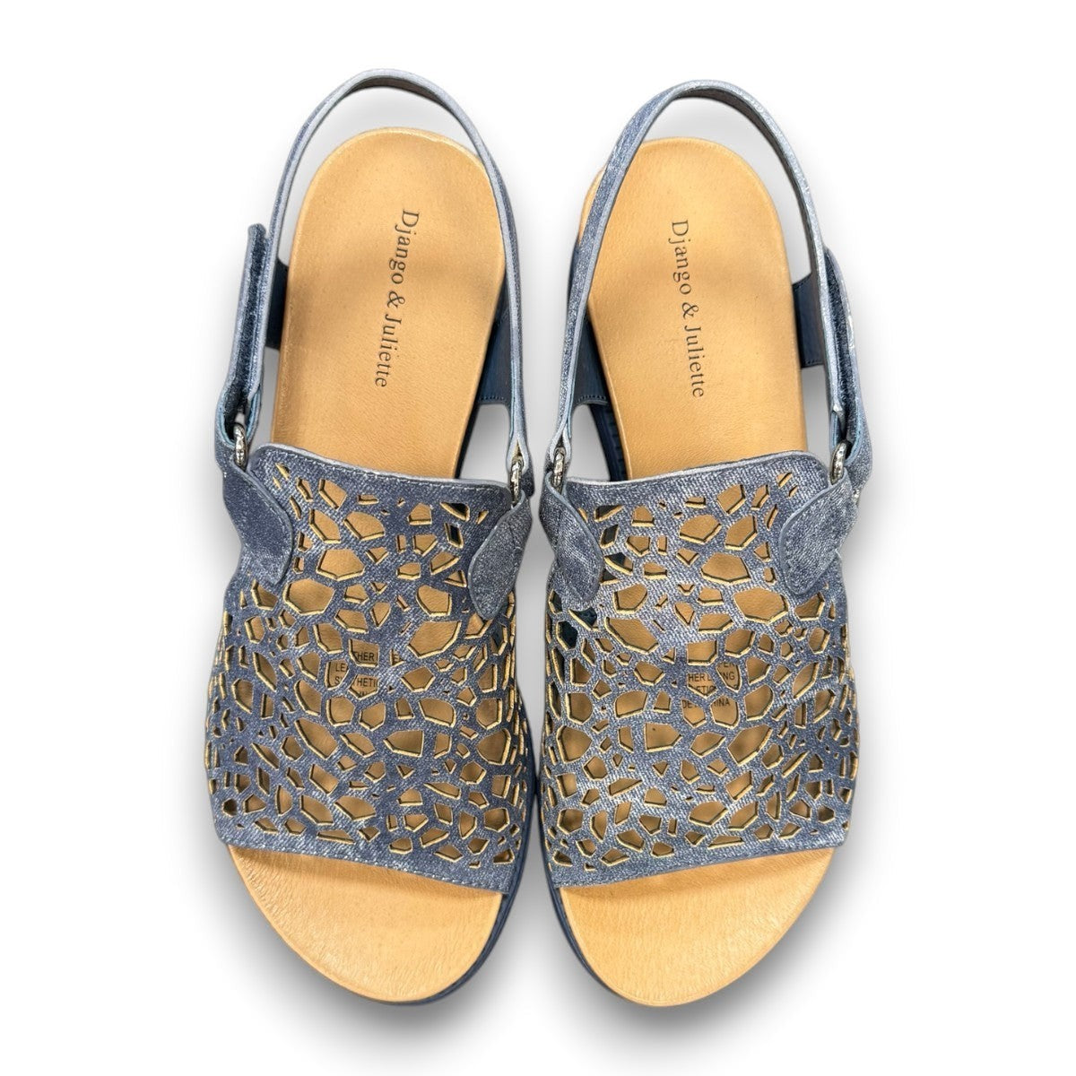 Django & Juliette blue denim leather flatform sandals with intricate laser-cut patterns and sporty sole. top view.