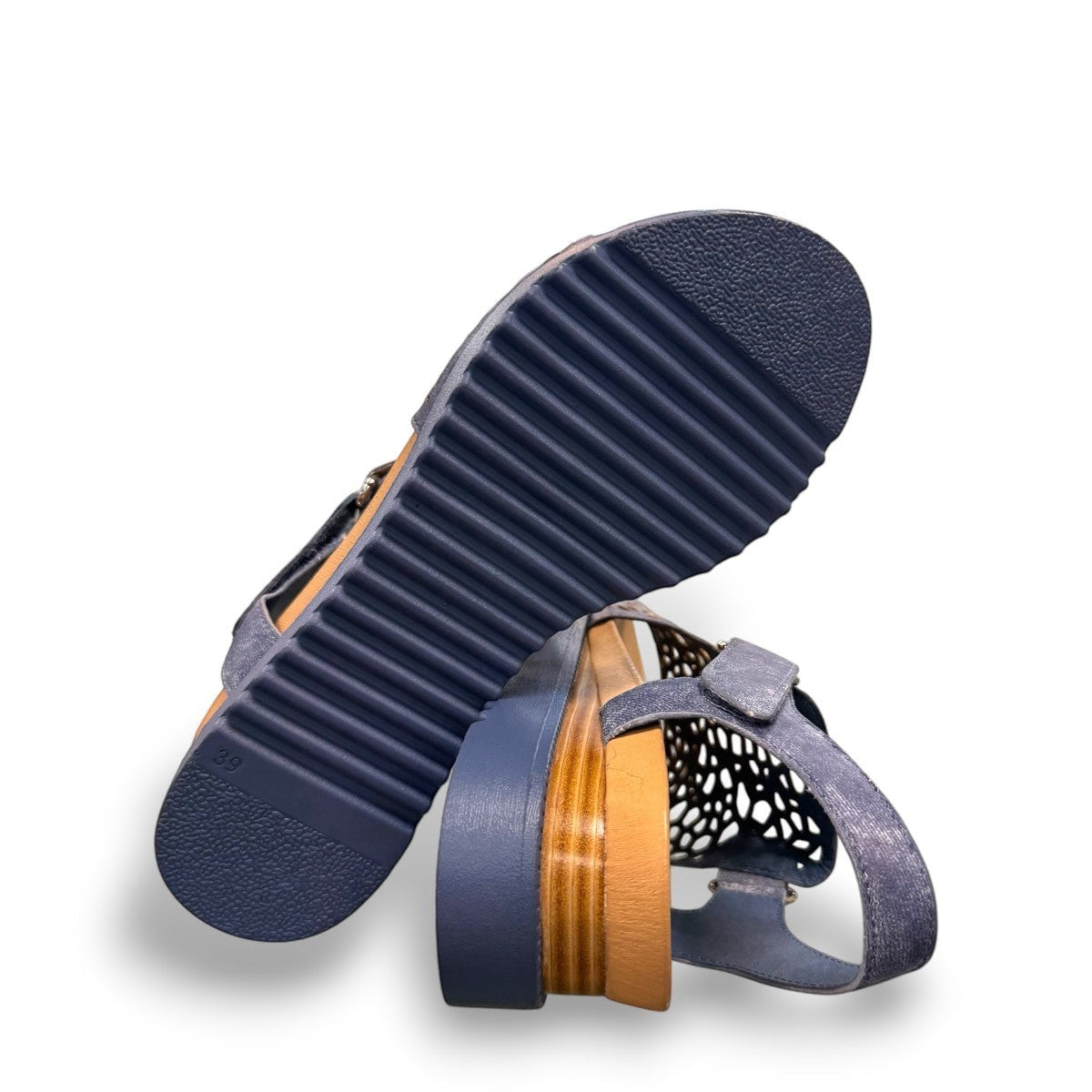 Django & Juliette blue denim leather flatform sandals with intricate laser-cut patterns and sporty sole.bottom view.